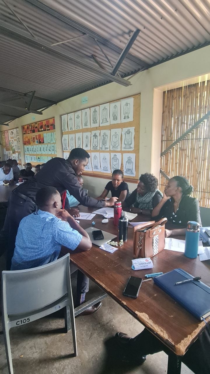 Solomon Tatwebwa supporting teachers during a group training activity