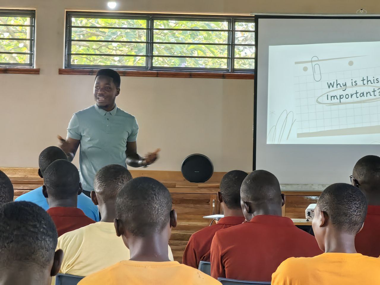 Solomon Tatwebwa facilitating a leadership workshop on the Seven Habits of Highly Effective People for high-school graduates